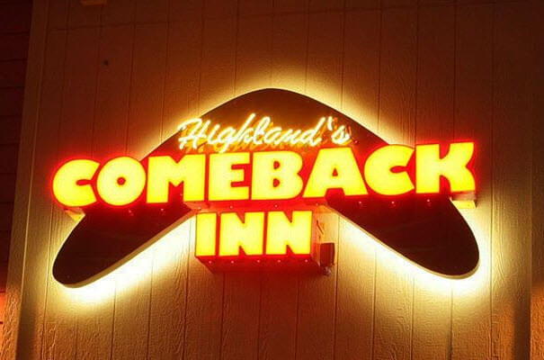 Neon sign: Highlands' Comeback Inn glowing brightly.